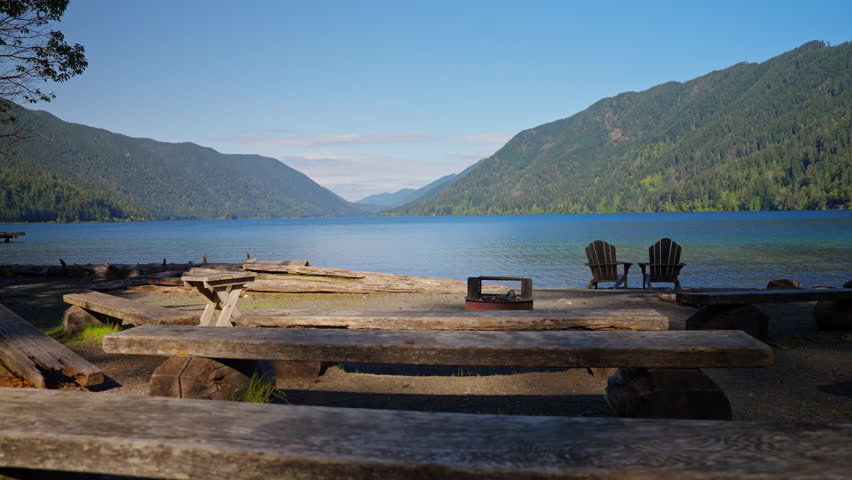 Lake Crescent in Olympic National Park, Washington, with clear blue water, forested shores, and mountain scenery. Ideal for nature, travel, and landscape footage.