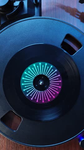 Vertical View, Starting Playback of Single Vinyl Record on Spinning Turntable, Top Down