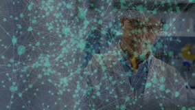 Network overlay fading in driving lab scientist pipetting yellow liquid into test tube for analysis. Scientist, laboratory, experimentation, precision, innovation, research, data - Powered by Shutterstock - Get 15% off with code: PIKWIZARD15