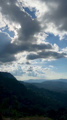 Bright Mountain Landscape with Fluffy Clouds on a Sunny Day
