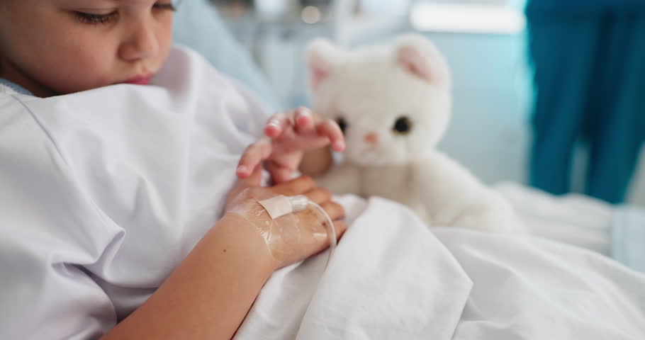 Sad girl, child or drip with hospital bed for chronic illness, disease or recovery in clinic. Sick, kid or hands with IV therapy, nutrition or immune booster for medical cure, diagnosis or medication