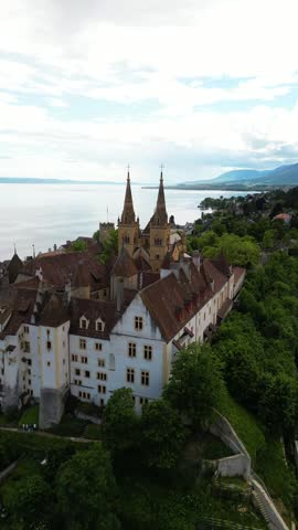 Neuchâtel Castle and the adjacent Collegiate Church Switzerland aerial drone vertical video