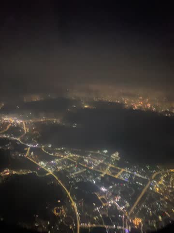 Aerial view of town at night from aeroplane