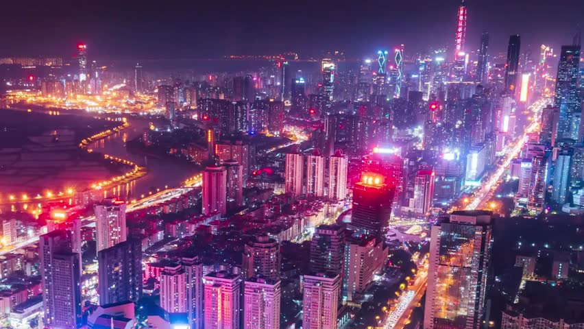 Cityscape view of Shenzhen at night, featuring illuminated skyscrapers, bustling urban streets, and vibrant metropolitan nightlife in China.