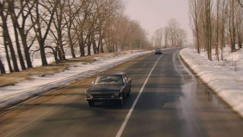 Police catch up during a high-speed pursuit, capturing law enforcement action, urgency, and intense urban or highway chase scenes.