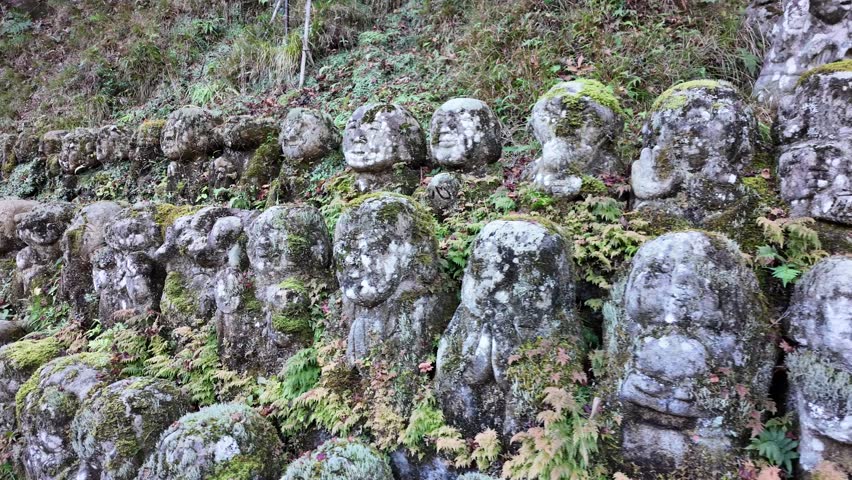 Moss-Covered Rakan Stone Statues at Otagi Nenbutsu-ji Temple in Kyoto, Japan