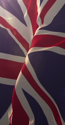 Flag of United Kingdom at sunset. 4K Vertical. Loop