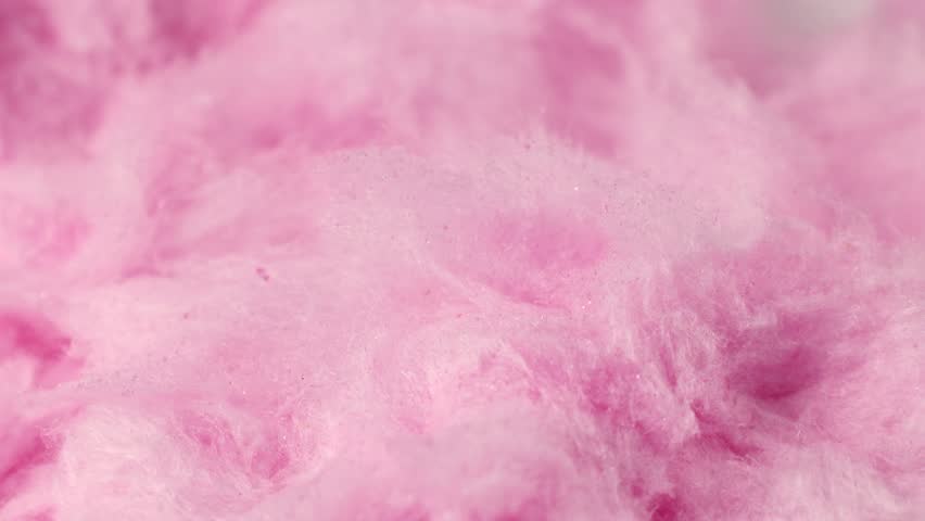 Light pink sweet fluffy cotton candy texture circle rotation close up