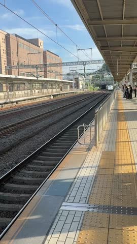 POV of A bullet train pulling into the station in Odawara, Japan.