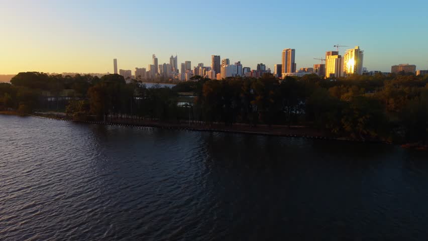 Revealing Perth city skyline from behind the iconic Herisson Island in Western Australia