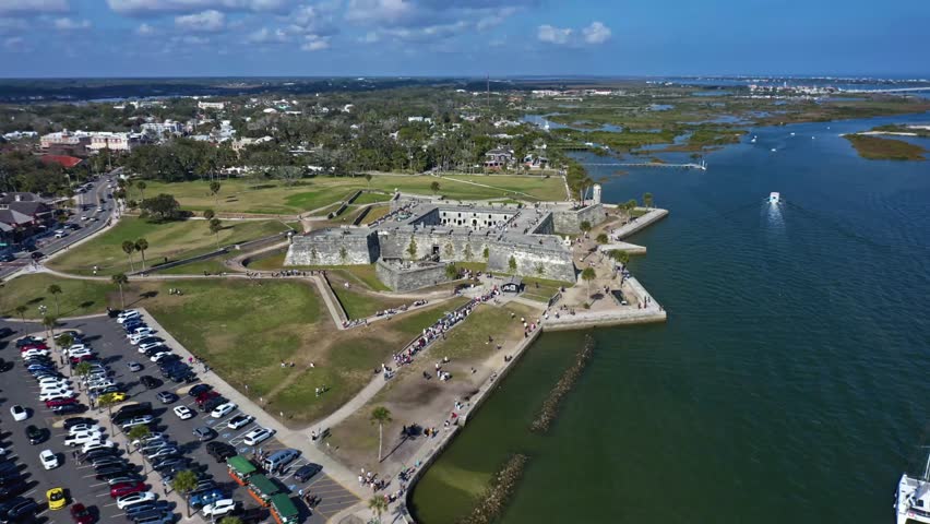 Castillo de San Marcos, the oldest masonry fort in the continental United States, stands prominently on the Matanzas River waterfront in St Augustine Florida, surrounded by parkland and urban areas.