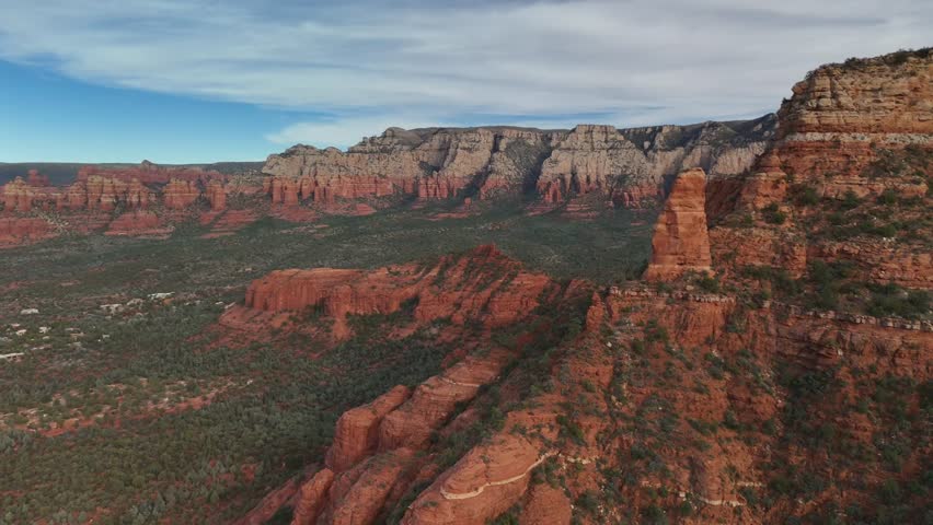 Epic 4K drone footage of red rock mountain peak in sedona arizona with view of valley and mountains below