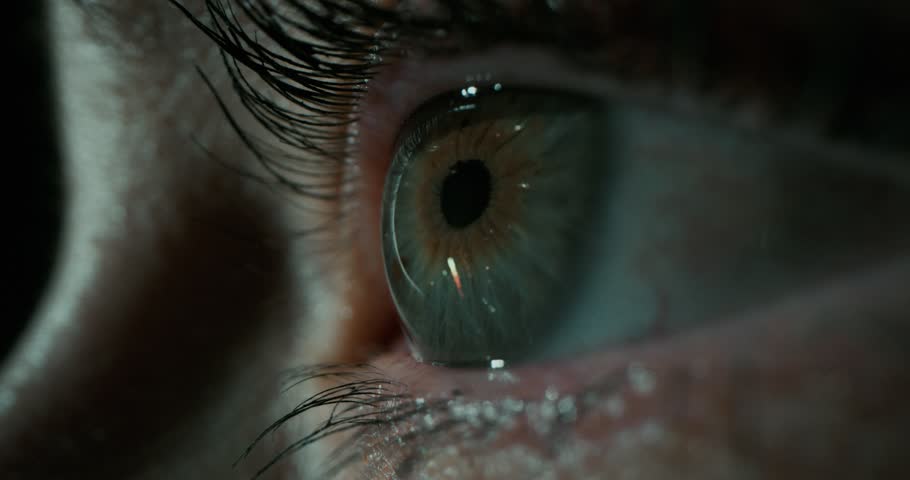 Close-up of an eye reflecting colorful fireworks, capturing wonder, celebration, excitement, and the magical feeling of festive moments.