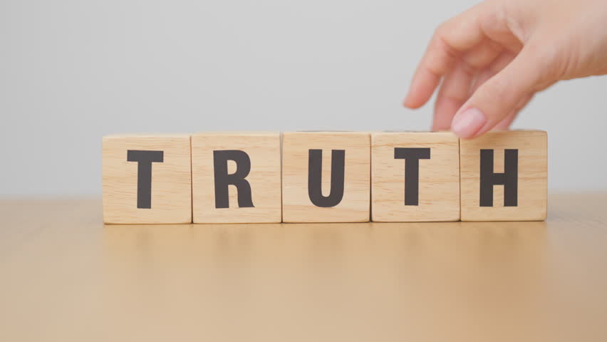 hand change wooden block TRUST to TRUTH. Trustworthy, Truth, beliefs business and agreement concept