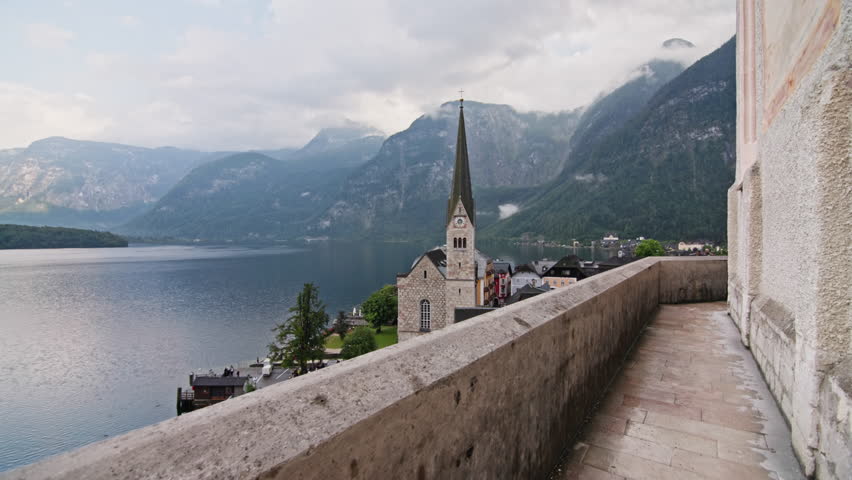 Hallstatt church Austria architecture. Beautiful streets on the lakeside in the Alps historic cathedral and traditional houses, tourist Europe.