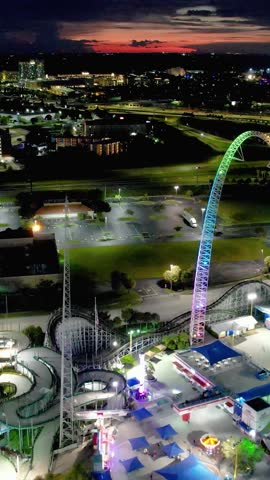 Sunset at downtown Orlando Florida United States. Sunset aerial view of scenic amusement park and traffic at landmark avenue. Sunset Orlando Florida. Sunset city Orlando United States.