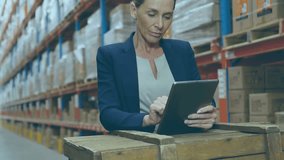 Animation of data processing over caucasian businesswoman using tablet in warehouse. Global shipping, computing and digital interface concept digitally generated video. - Powered by Shutterstock - Get 15% off with code: PIKWIZARD15