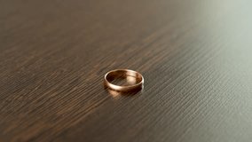 Close-up of Hand Picking Up a Diamond Gold Ring - Powered by Shutterstock - Get 15% off with code: PIKWIZARD15