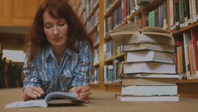 Animation of mathematical equations over female student studying in library. Back to school and education concept. - Powered by Shutterstock - Get 15% off with code: PIKWIZARD15