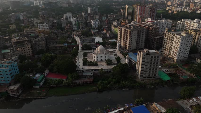 Aerial footage of a white mosque in the middle of Adabar of Dhaka, Bangladesh