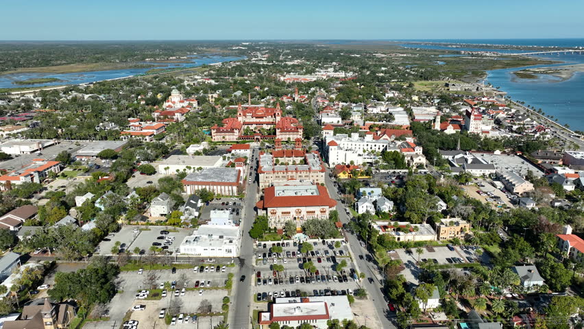 A cinematic drone view over Flagler College and the Lightner Museum highlights St. Augustine’s iconic Spanish Renaissance architecture.