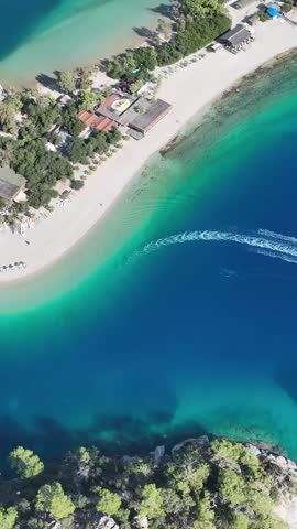 Aerial vertical view of Ölüdeniz Beach, one of Turkey’s most famous summer destinations.