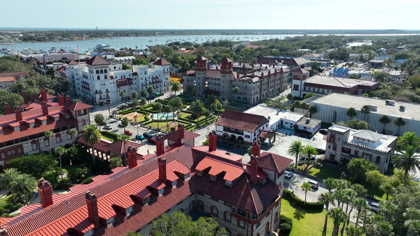 A drone view flying over Flagler College towards the Lightner Museum in St. Augustine, Florida.