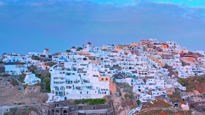 Drone view of Santorini island. Flying over famous Oia town