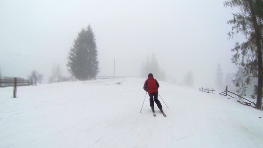 Slow Motion camera view of skier is riding in the mountains.