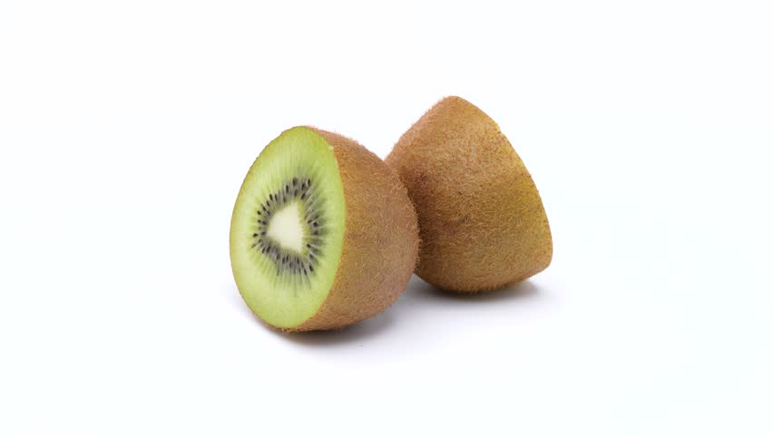 Video of Kiwifruit turning on a white background.
