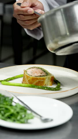Culinary, plating or hands in kitchen with sauce, catering or presentation in luxury cuisine. Hospitality, chef or man in restaurant with prep, aesthetic dinner or dish decorating in fine dining.