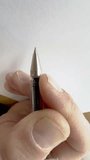 Person handwriting the word handwriting in cursive script in close up - Powered by Shutterstock - Get 15% off with code: PIKWIZARD15