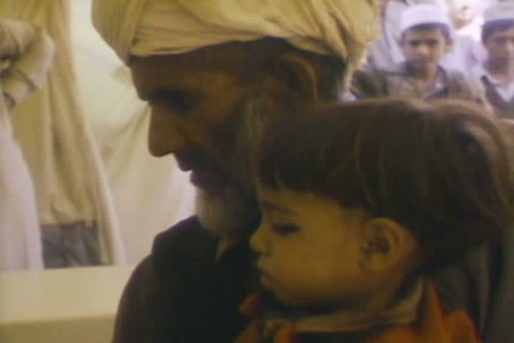 1980s - Montage of refugees from Afghanistan making their way to Pakistan during the Soviet invasion.