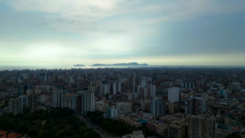 Beautiful backlit sunset aerial view of Lima, Peru in South America.	