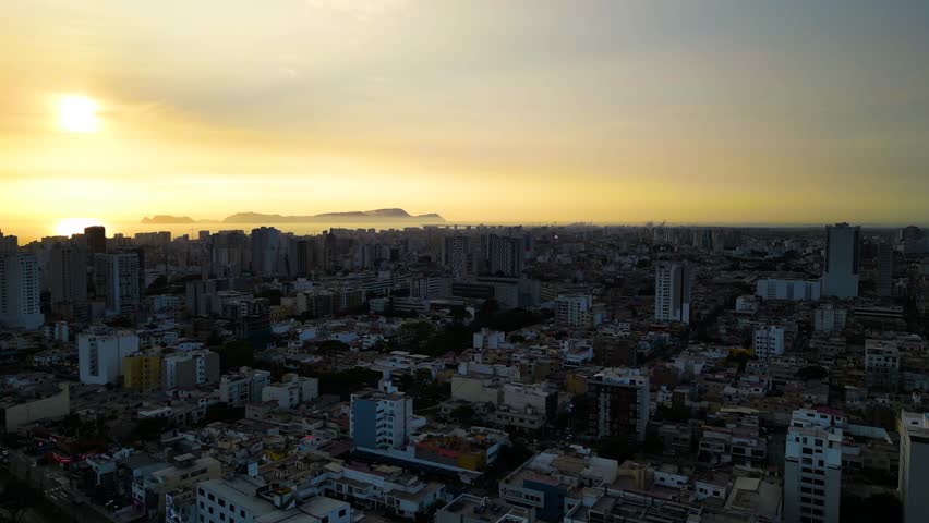 Golden summer sunset over Lima city skyline, Jesus Maria district, Peru.