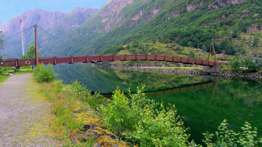 Wooden bridge over Naeroydalselvi river in Gudvangen Vestland Norway