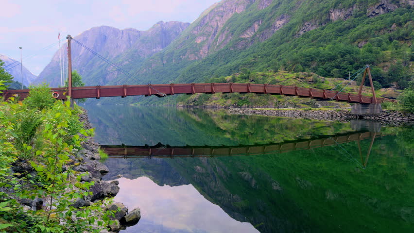 Wooden bridge over Naeroydalselvi river in Gudvangen Vestland Norway