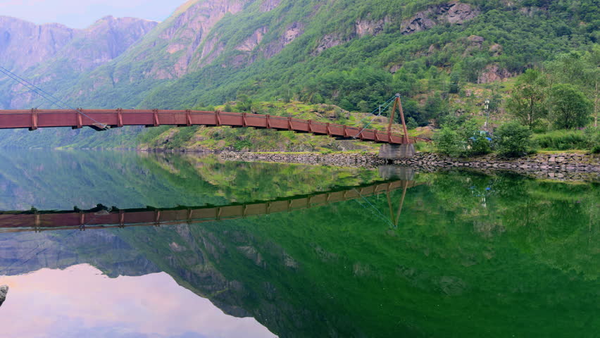 Wooden bridge over Naeroydalselvi river in Gudvangen Vestland Norway