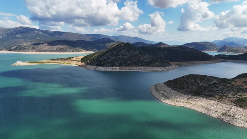 Aerial drone timelapse video of artificial lake of Yliki in Boeotia prefecture with calm waters and beautiful clouds, an important source of drinking water for the Athens, Greece