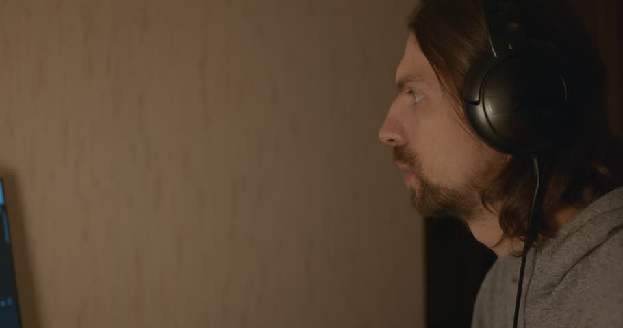 Man Eats Omelet, Salad Buckwheat Porridge in room Near Computer in the Evening. 4K 10-bit