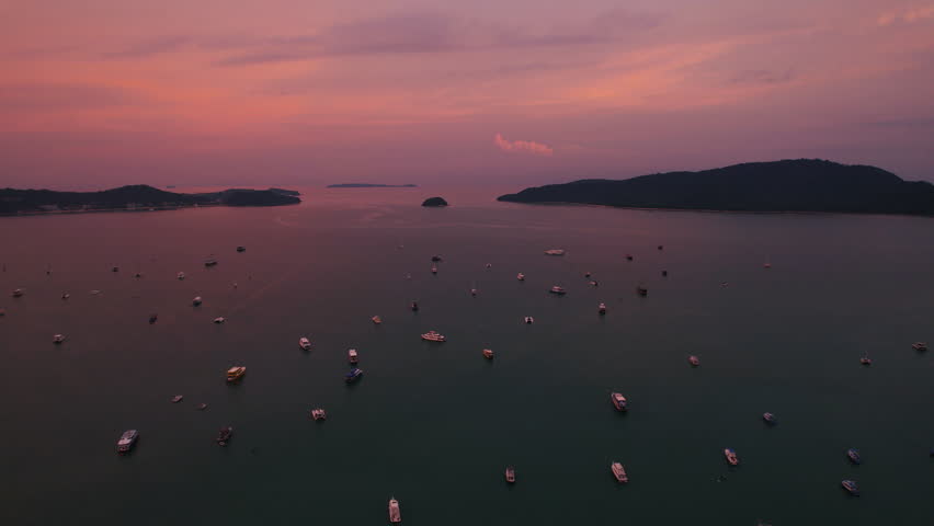 Aerial view of boats in a Phuket bay during a beautiful sunset