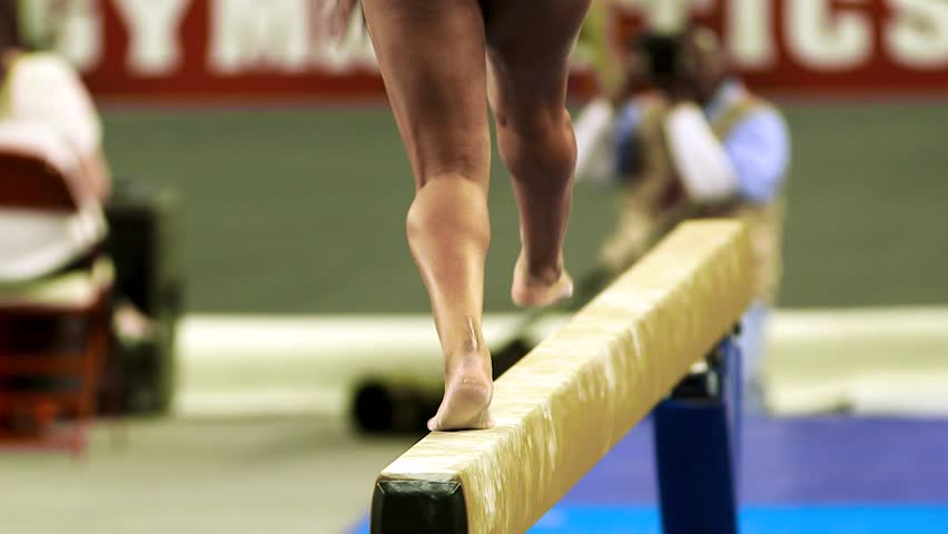 close up of gymnast feet on balance beam