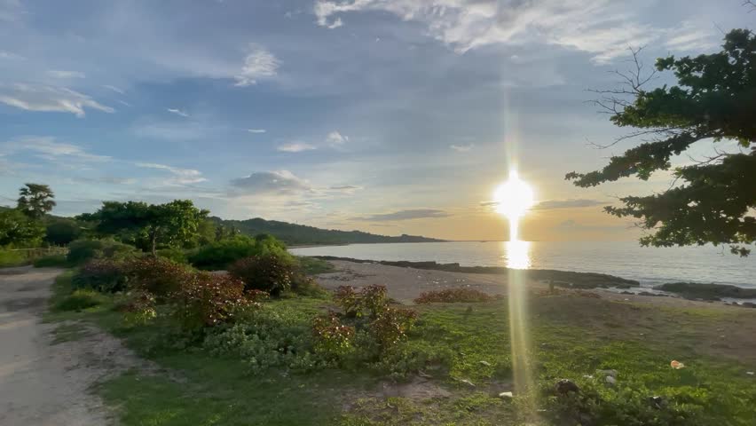 sunset view from the beach in calm sea waters