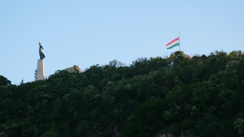 Hungarian flag waving next to the Monument for Daniel Bogdanich, Budapest, Hungary