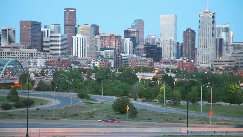Denver skyline featuring modern buildings, roads, and greenery, capturing the urban landscape and city life in Colorado, USA.