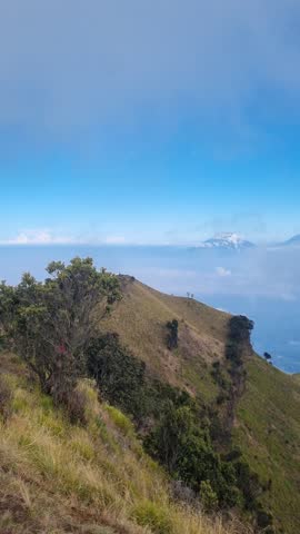 vibes on the top of merbabu mountain java indonesia, view merapi mountain and sea ​​of ​​clouds