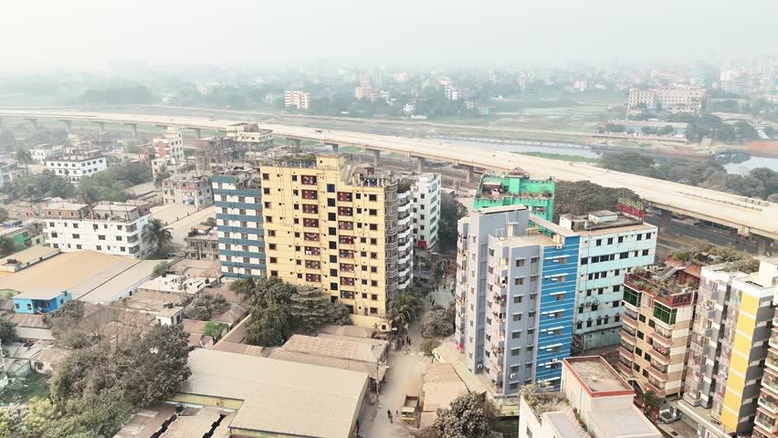 Dhaka, Bangladesh – aerial drone view showing city buildings from above. Captured on 21 January 2026, highlighting urban infrastructure and city expansion.