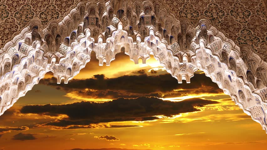 Arches in Islamic (Moorish)  style (against the sunset) in Alhambra, Granada, Spain. 4K, time lapse  