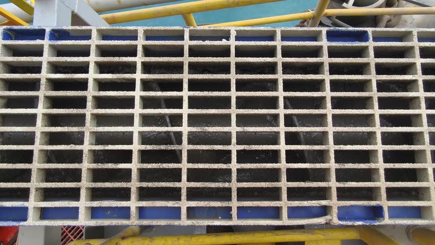 A screw conveyor (auger) used to transport drilling cuttings from solids control equipment  to a vertical cuttings dryer for fluid recovery and waste management
