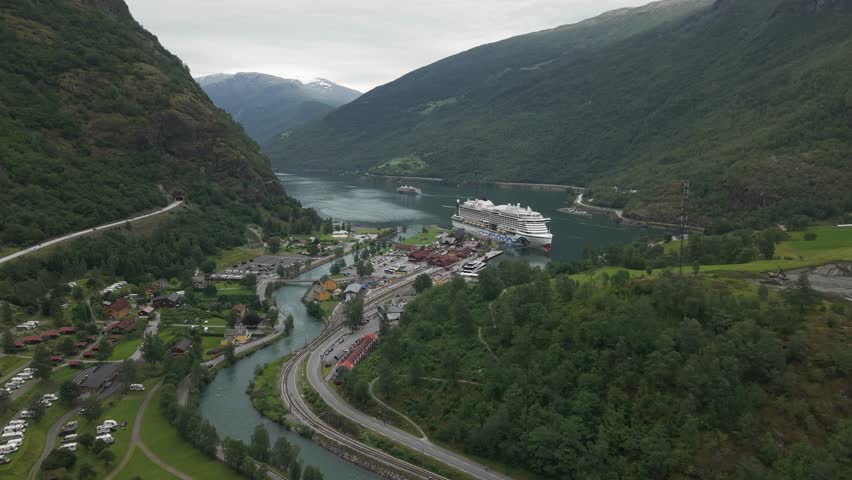 Cruise Ship Docked On Aurlandsfjord In Village Of Flam In Norway. wide aerial shot